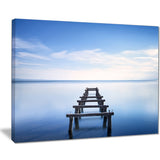 jetty remains in blue lake seascape photo canvas print PT8366